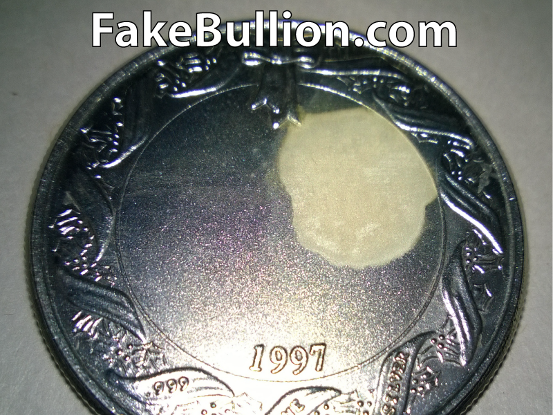 testing solution on genuine silver round