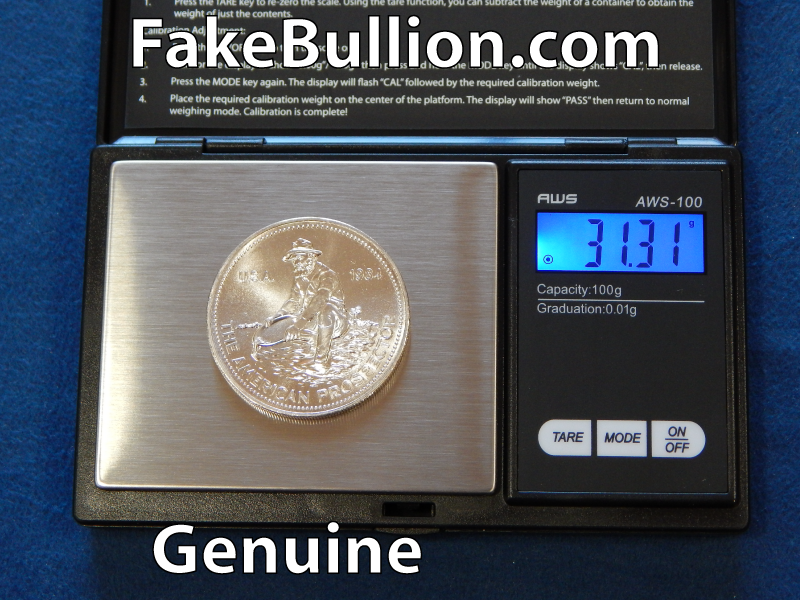 weighing genuine silver round